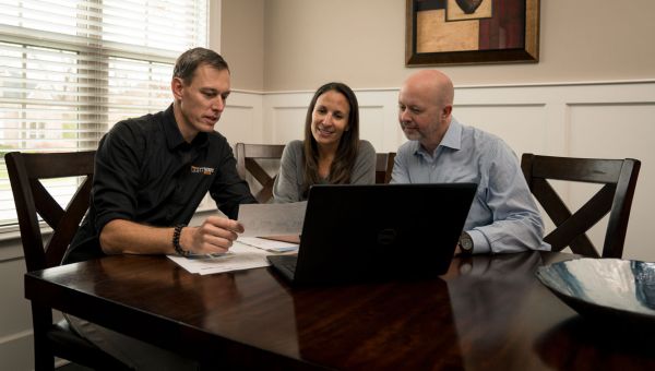Lightwave consultant going over solar proposal with clients