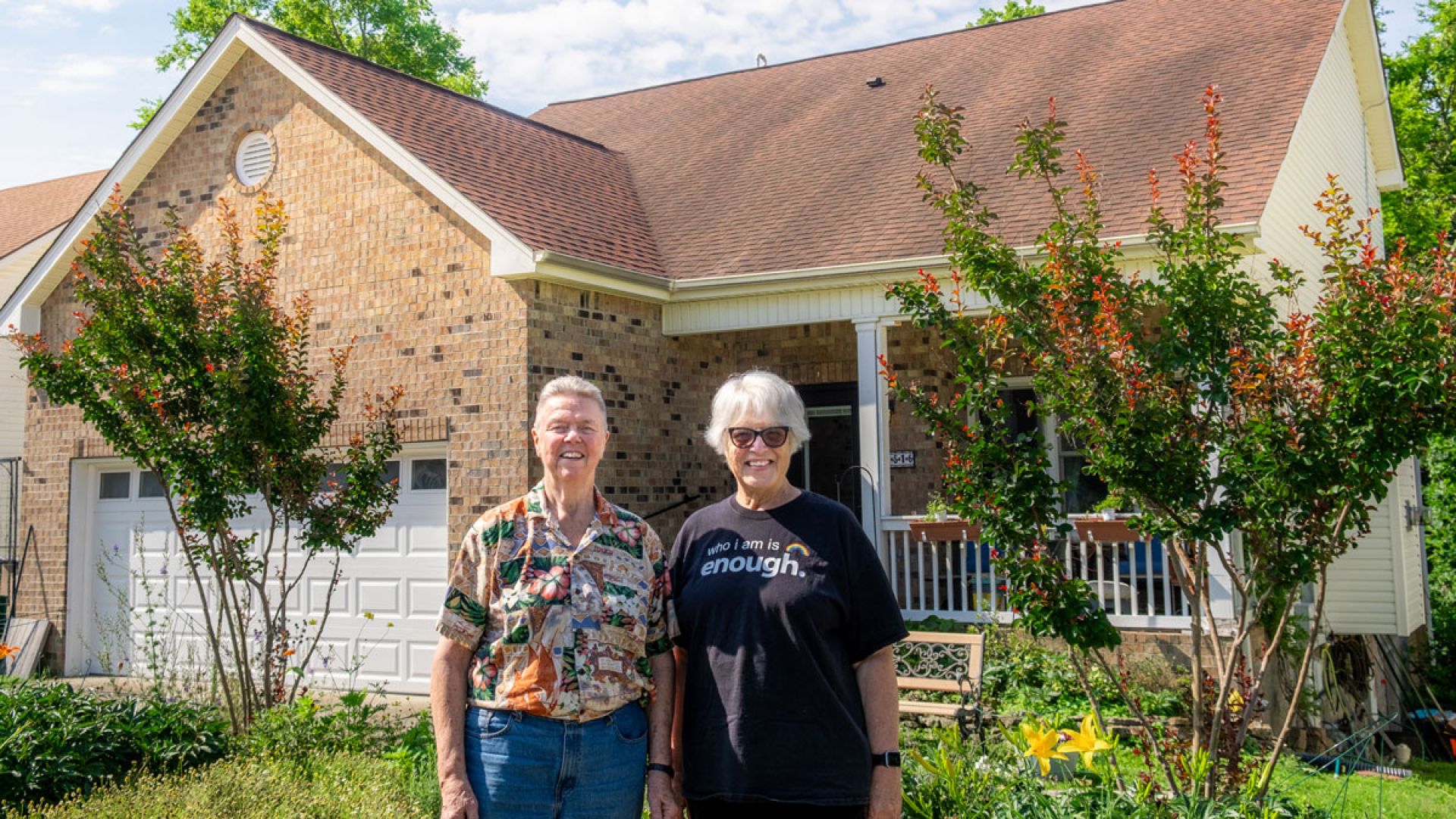 MAT and Linda Ray in front of their home